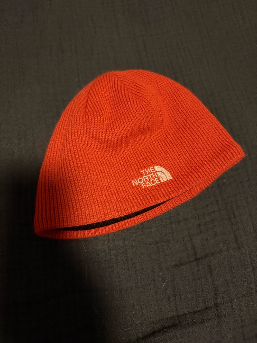 The North Face orange knitted Beanie with Logo